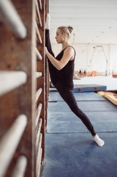 side view blonde woman exercising gymnastics olympics