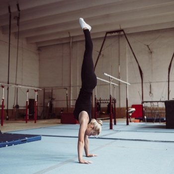 sideways blonde woman training gymnastics olympics 2