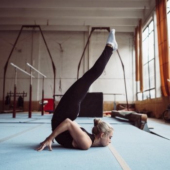sideways blonde woman training gymnastics olympics