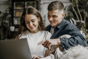 romantic young couple browsing laptop together 2