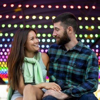 smiley couple amusement park