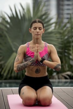front view woman doing yoga exercises