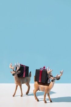 reindeers carrying christmas presents