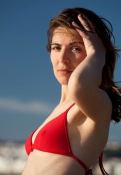 Outdoor portrait of a beautiful young woman on the beach