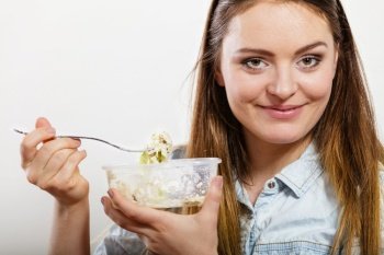 Woman eating fresh vegetable salad. Happy and joyful girl enjoying healthy food. Nutrition.. Woman eating fresh vegetable salad.