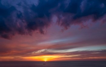 Beautiful sunset view, amazing landscape of a sunrise over sea, dark dramatic scene, abstract natural background