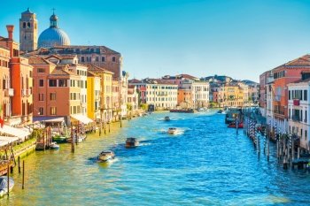 Grand canal in Venice - city travel landscape with boats and gondola