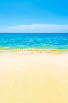 Blue sea blue water and sand beach with blue sky as summer holiday vacation background