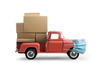 Safe delivery. Car in mask delivering blank boxes. Loaded pickup truck with protection isolated on white background.. Safe order delivery