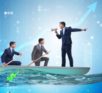 Team of businessmen in teamwork concept with boat. The team of businessmen in teamwork concept with boat