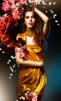 sensual sexy woman in green dress with flowers and blue light 