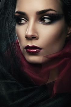 close-up portrait of sexy woman in black hood