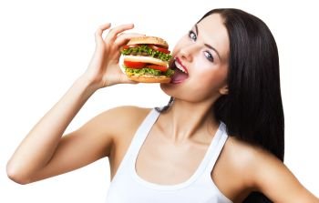 woman biting hamburger on white background