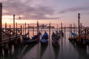 Sunrise in San Marco square, Venice, Italy. Venice Grand Canal. Architecture and landmarks of Venice. Venice postcard with Venice gondolas