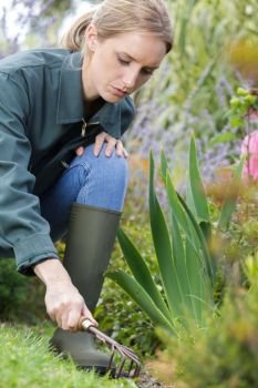 female gardener using a trowel