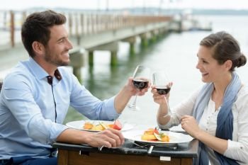 happy couple having romantic dinner outdoors
