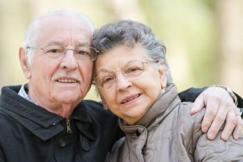 Closeup of elderly couple cuddling
