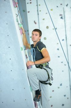 Man on indoor climbing wall