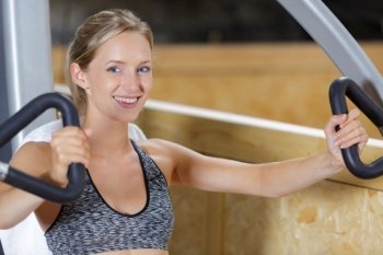 smiling female training in the gym