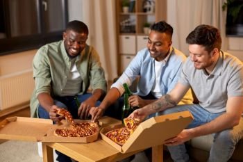 friendship, food and people concept - happy male friends drinking beer and eating pizza at home. happy male friends with beer eating pizza at home