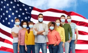 health, safety and pandemic concept - group of people wearing protective medical masks for protection from virus over american flag background. people in medical masks for protection from virus
