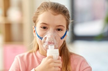 health, medical equipment and people concept - sick little girl wearing oxygen mask. sick little girl wearing oxygen mask