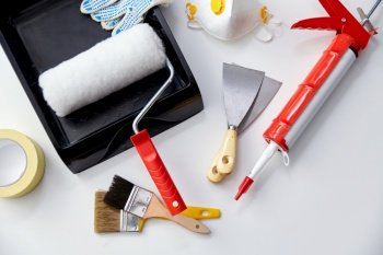 repair, building and renovation concept - different painting work tools on white background. different painting work tools on white background