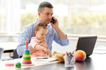 remote job, multi-tasking and family concept - middle-aged father with baby and laptop calling on smartphone at home office. father with baby calling on phone at home office