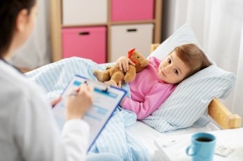 healthcare, medicine and people concept - doctor with clipboard and little sick girl lying in bed at home. doctor with clipboard and sick girl in bed at home