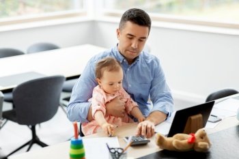 remote job, multi-tasking and family concept - middle-aged father with baby, calculator and tablet computer working at home office. father with baby working at home