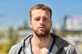 fitness, sport and people concept - portrait of young man outdoors. portrait of young man outdoors