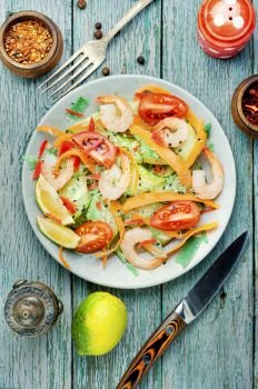 Diet salad with tomato, cucumber and shrimp.Healthy salad with shrimps. Salad with prawn and vegetables
