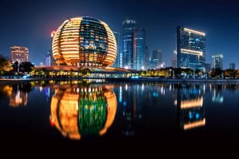 Night view of illuminated Qianjiang New Town with reflection, Hangzhou, Zhejiang, China. Night view of Qianjiang New Town with reflection, Hangzhou, Zhejiang, China