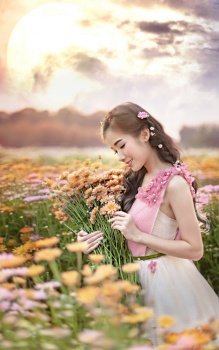 portrait of beautiful asian woman in nature flowers field. portrait of beautiful asian woman