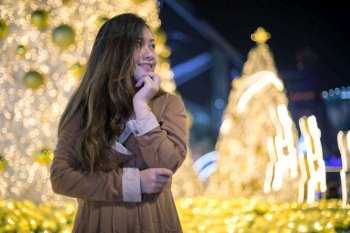 Portrait of asian woman, outdoor in night. Christmas and New Year concept