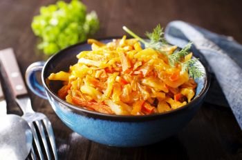 Cabbage stew with carrot in tomato sauce - traditional dish of  Russian cuisine
