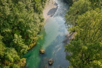 Drone view of the Serio river during the day, Val Seriana Bergamo.