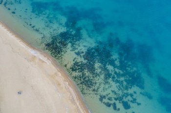Top view aerial photo from flying drone of beautiful sea landscape with turquoise water with copy space for your advertising text message or promotional content. website background.