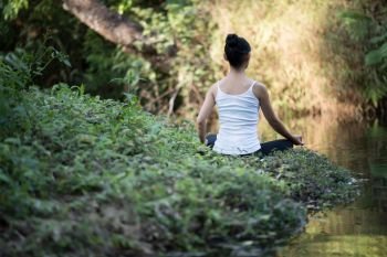 woman playing yoga garden field weekend holiday lifestyle park outdoor nature background.