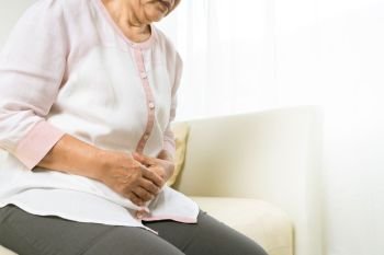 stomach pain of old woman at home, healthcare problem of senior concept