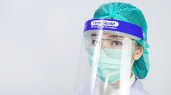 Scientist doctor wearing face mask, glasses or goggles and protective suit to fight coronavirus pandemic Covid-19, coronavirus pandemic threat quarantine, medical and healthcare concept