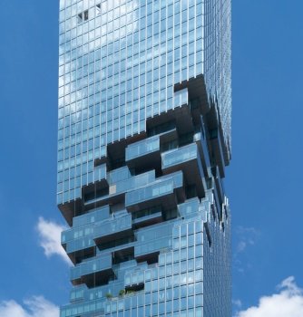 Pattern of office buildings windows. Glass architecture facade design with reflection in urban city, Downtown Bangkok. Urban city in financial district with blue sky. Mahanakhon.