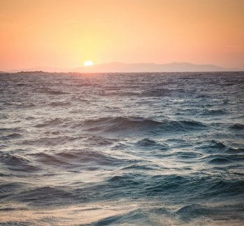 sea waves at sunset summer holiday background