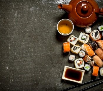 Japanese food. The rolls and sushi with soy sauce and herbal tea.. The rolls and sushi with herbal tea.