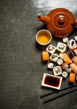 Japanese food. The rolls and sushi with soy sauce and herbal tea.. The rolls and sushi with herbal tea.