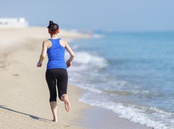 Woman Exercising On Beach ( running )