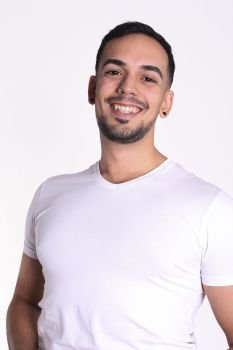 Portrait of smiling handsome man in white t-shirt looking at camera