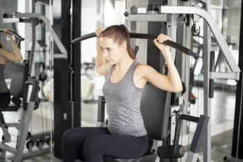 Pretty young sport woman is Workout in gym, Healthy lifestyle 