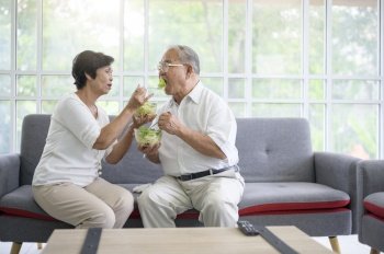 An elderly couple are eating healthy food , grandparents health care concept .. An elderly couple are eating healthy food , grandparents health care concept 