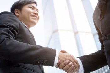 business and office concept - businessman shaking hands 
